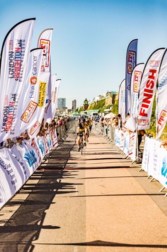 Riders finish the London to Brighton cycle on Brighton beach front