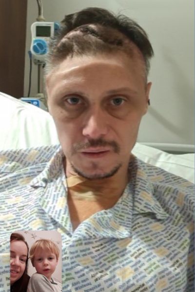 Phil and family on a video call after his craniotomy following brain injury.