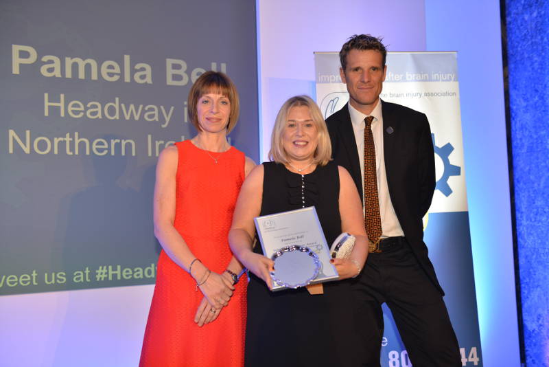 Pamela Bell (centre) collecting her award