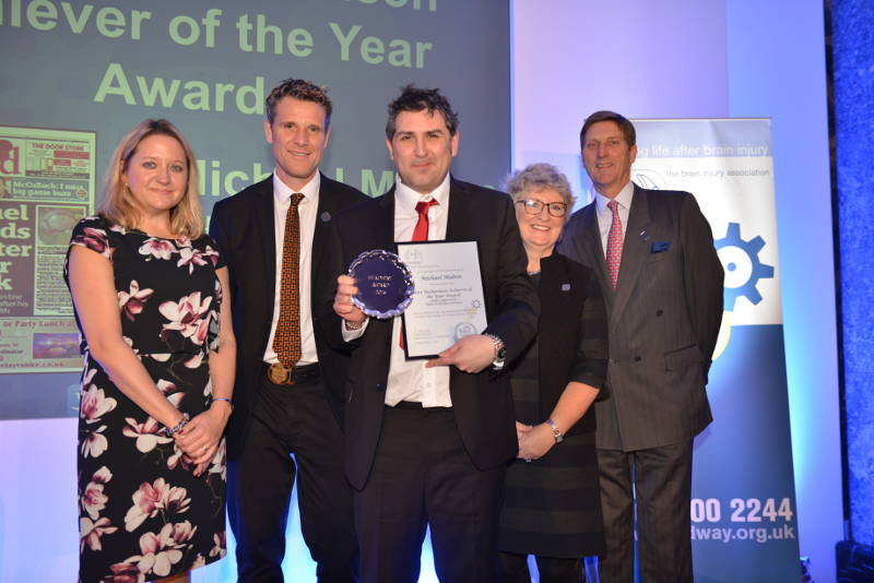 Michael Mabon (centre) collecting his Achiever of the Year Award