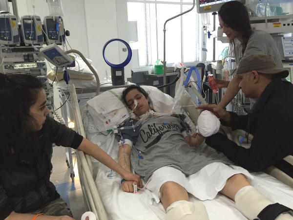 Anna's family by her bedside in intensive care