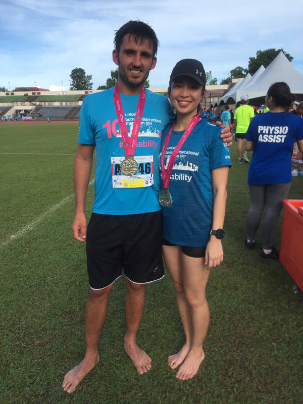 Ross (left) runs in the Borneo Marathon for Headway