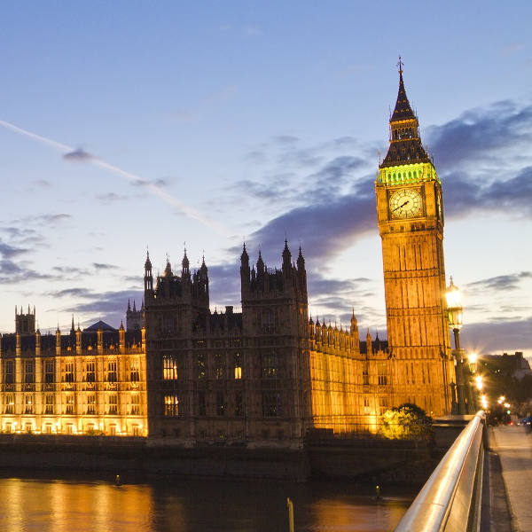 The Houses of Parliament lit up against a dusk sky