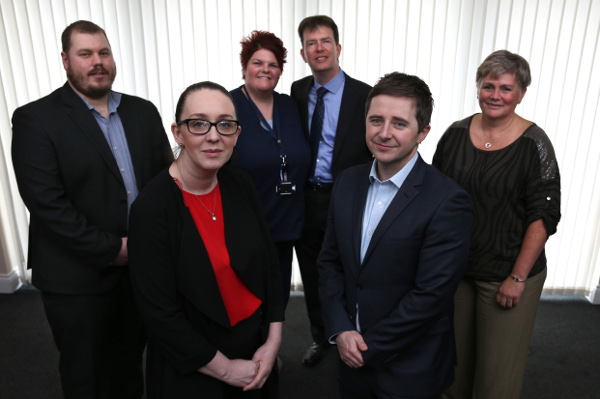 Giles (centre), HATS nurse Kerry Reynolds and the committee members of Headway Hartlepool.