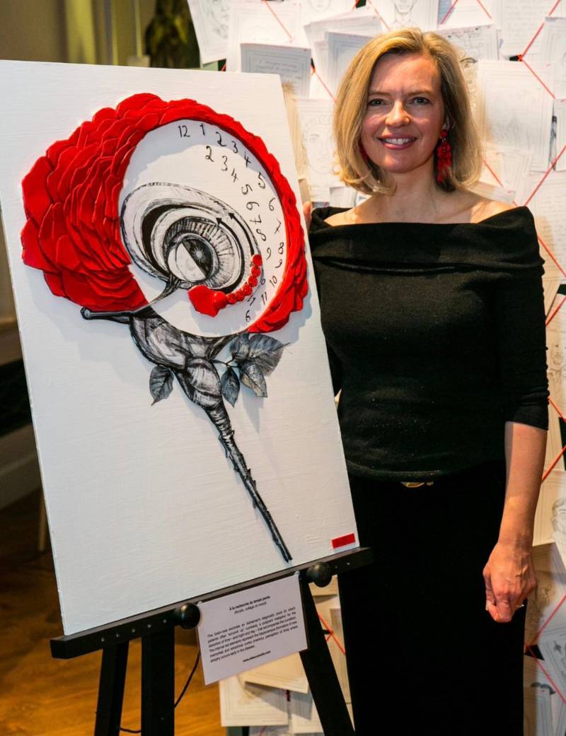 Rebecca stood next to a painting