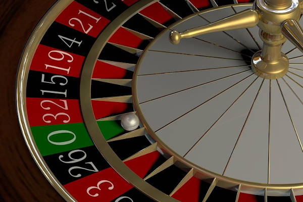 A roulette table, showing the ball in the 0 position