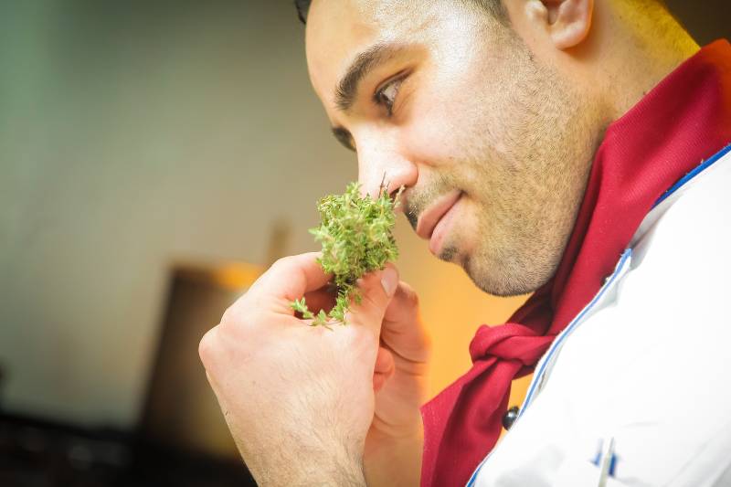 chef smelling herbs