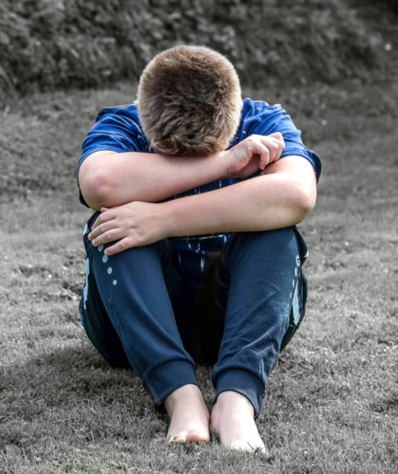 man with head in hands