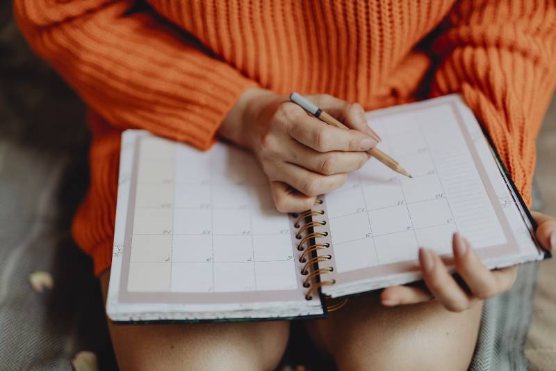 woman writing in diary