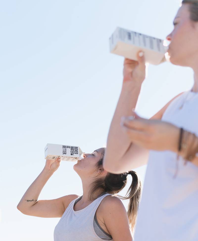 two people drinking water