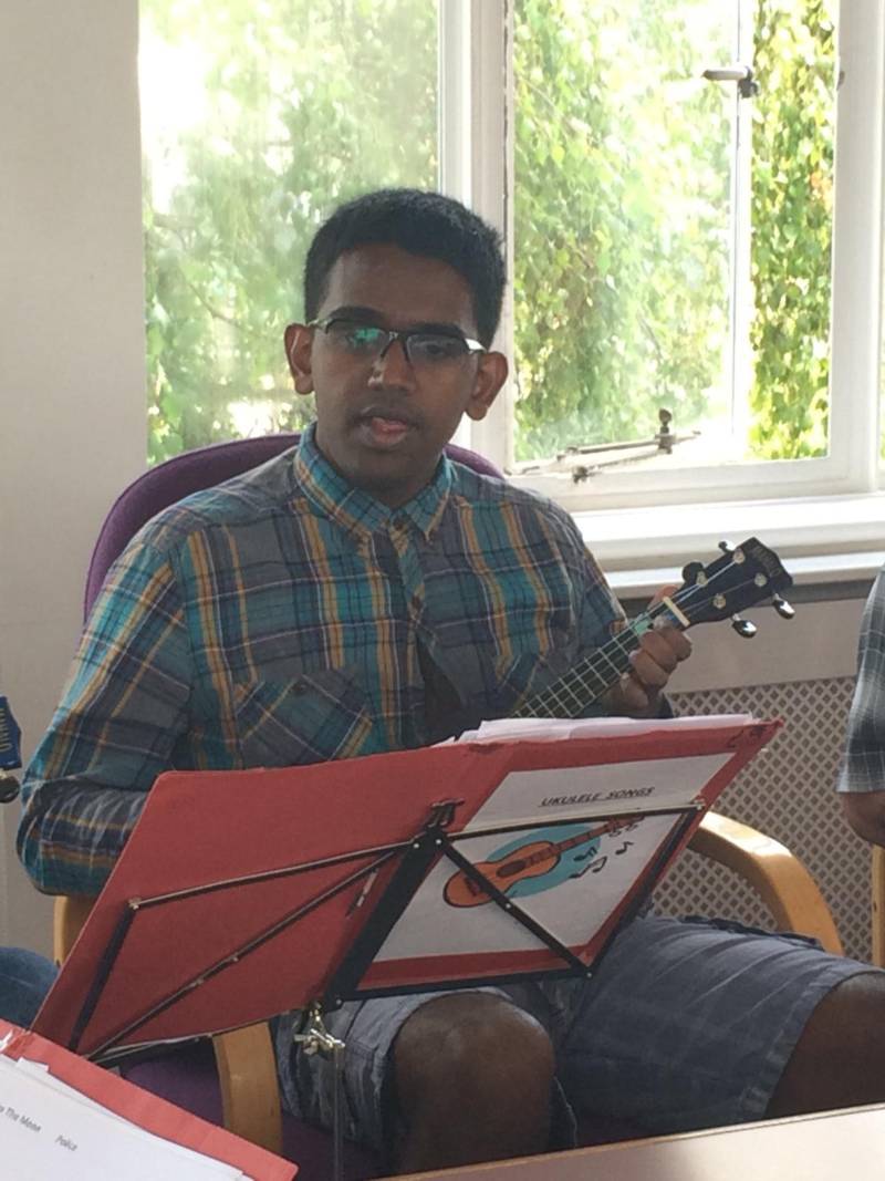 Jegan perfecting his ukulele recital