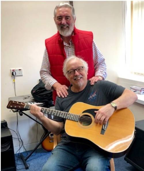 Phil proudly showing his new left-handed guitar