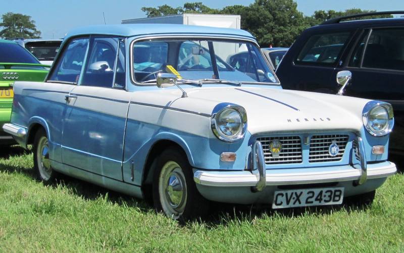 A blue and white Triumph Herald