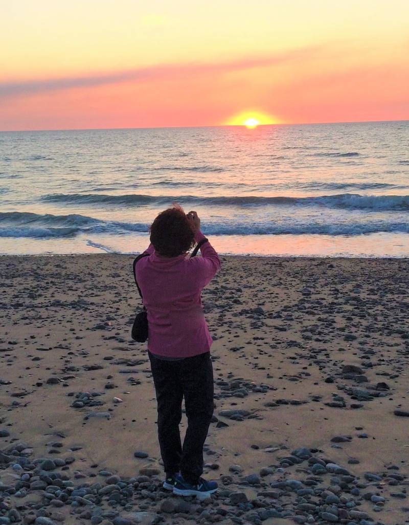 Alison enjoying her walks along the beach