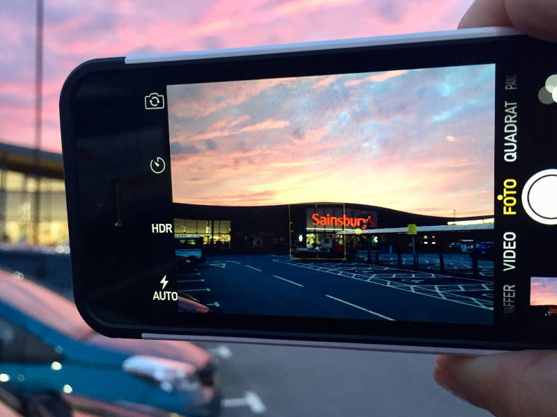 Taking a photograph of a supermarket car park