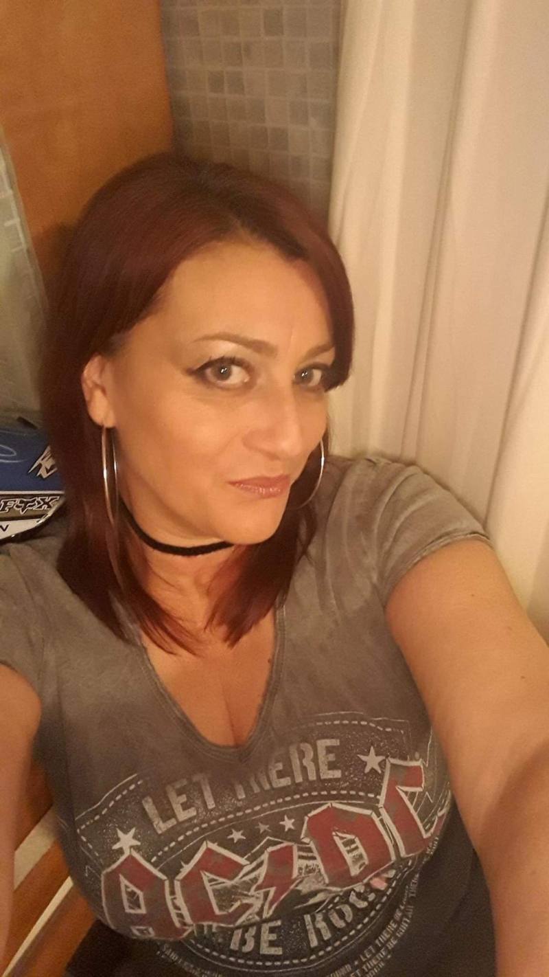 Lisa looking at the camera wearing a grey ACDC t-shirt