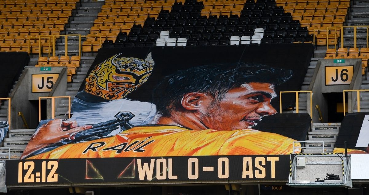 A previous banner of Raul Jimenez posted on the Wolves stadium. It shows Raul wearing a yellow football shirt with his name printed on the back. Below is the text denoting the match score - WOL 0 - 0 AST.