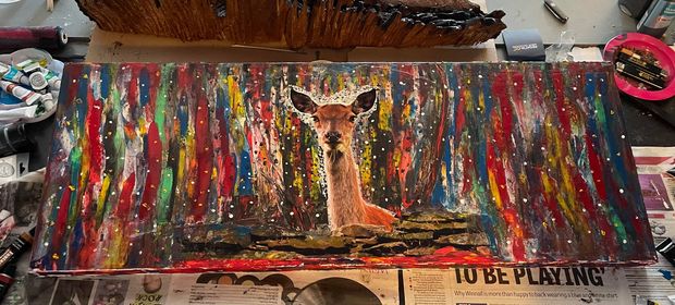 Painting over a deer photograph, by Rob Dinwoodie