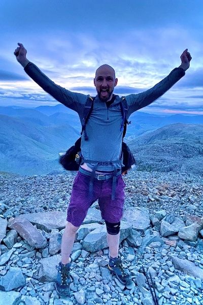 Nick Henderson celebrates at the top of Scafell Pike