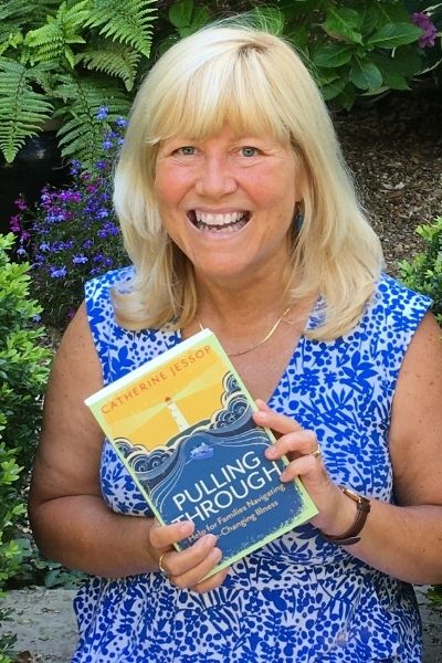 Catherine Jessop holding her book, Pulling Through