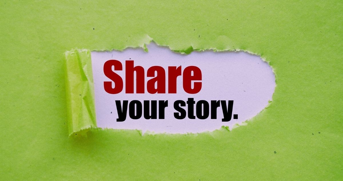 The text 'Share your story' is revealed by peeling back a sheet of green paper